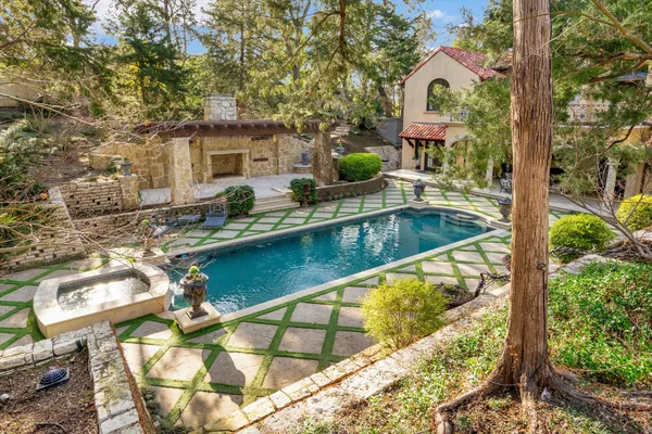 a view of swimming pool with a patio