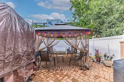 a view of a chairs and table in the terrace