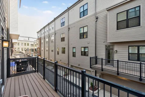 a view of a balcony with city view
