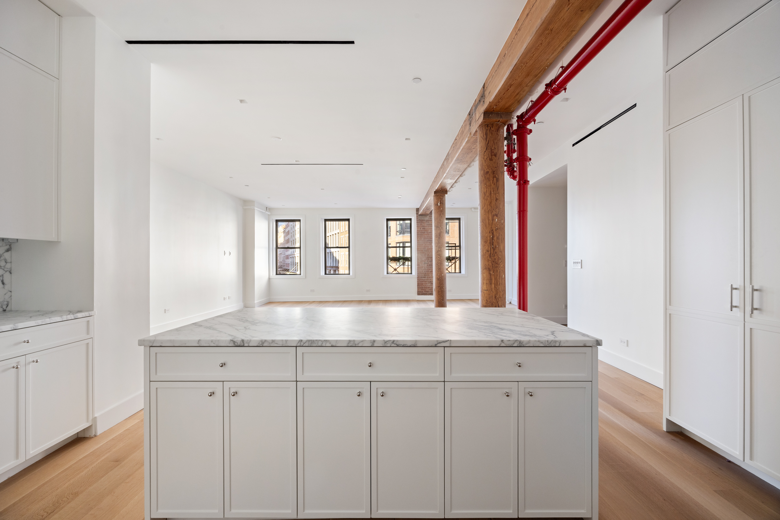 243 West Broadway, Unit 3 Manhattan, NY 10013 - Photo 10 of 25 a bathroom with a granite countertop sink and a mirror