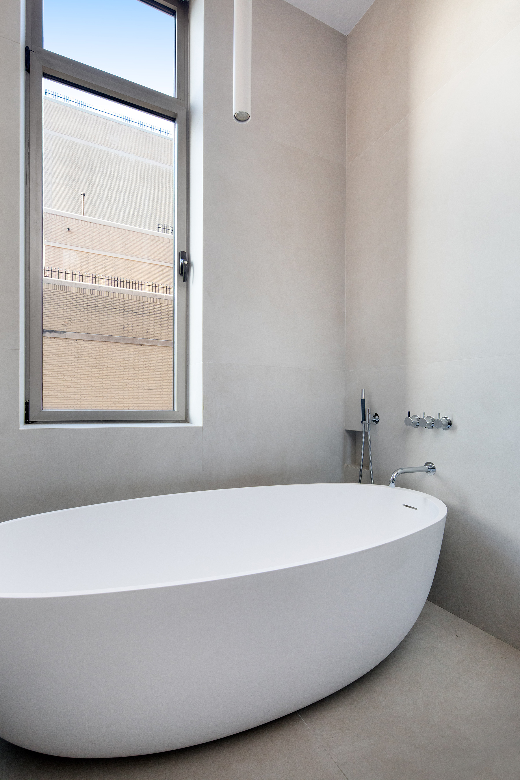 252 7th Avenue, Unit 10X Manhattan, NY 10001 - Photo 10 of 20 a bathroom with a bathtub