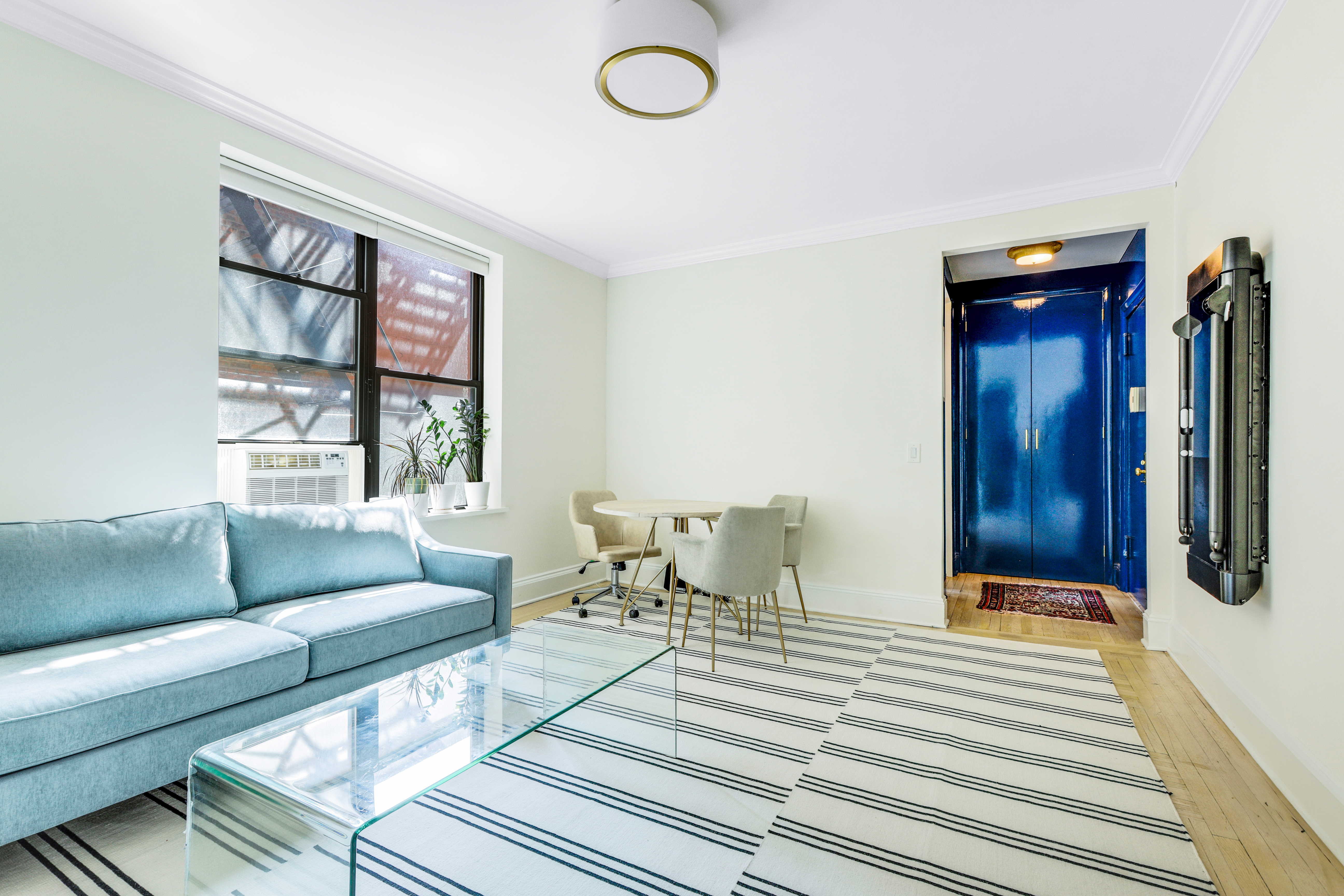 2 Grace Court, Unit 2C Brooklyn, NY 11201 - Photo 2 of 15 a living room with furniture and a window