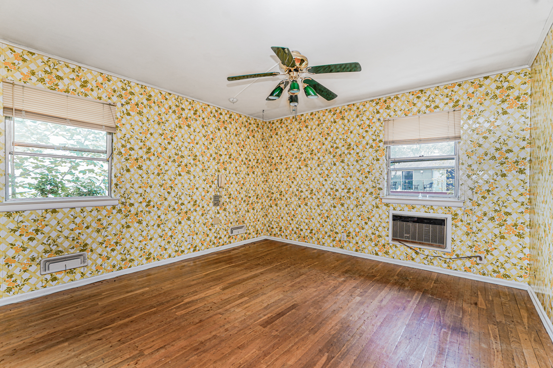 461 Mayfair Drive South Brooklyn, NY 11234 - Photo 16 of 30 a view of an empty room with wooden floor and a window