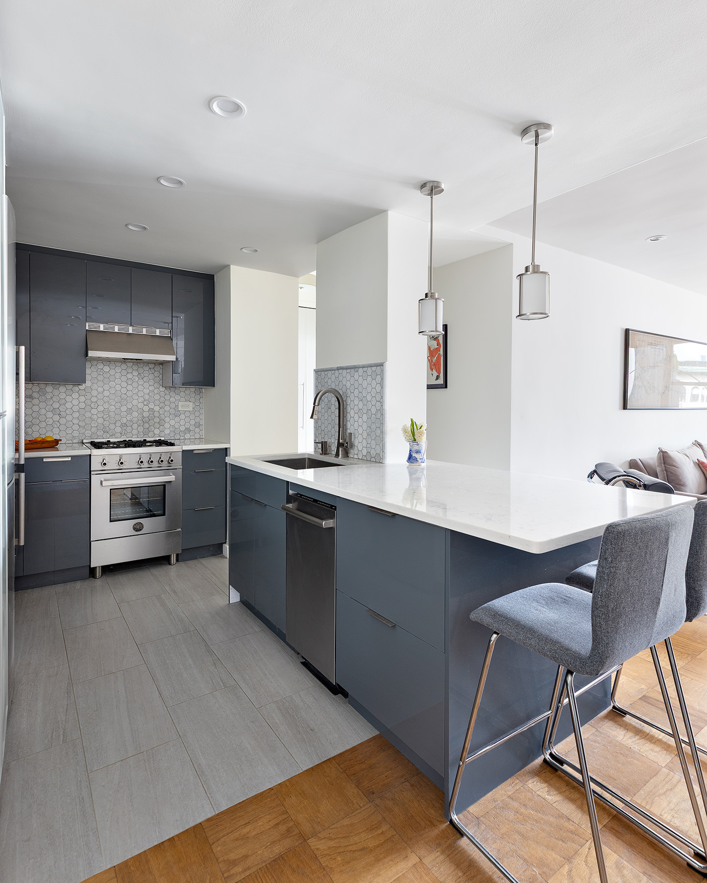 7 East 14th Street, Unit 18X Manhattan, NY 10003 - Photo 2 of 7 a kitchen with a sink cabinets and stainless steel appliances