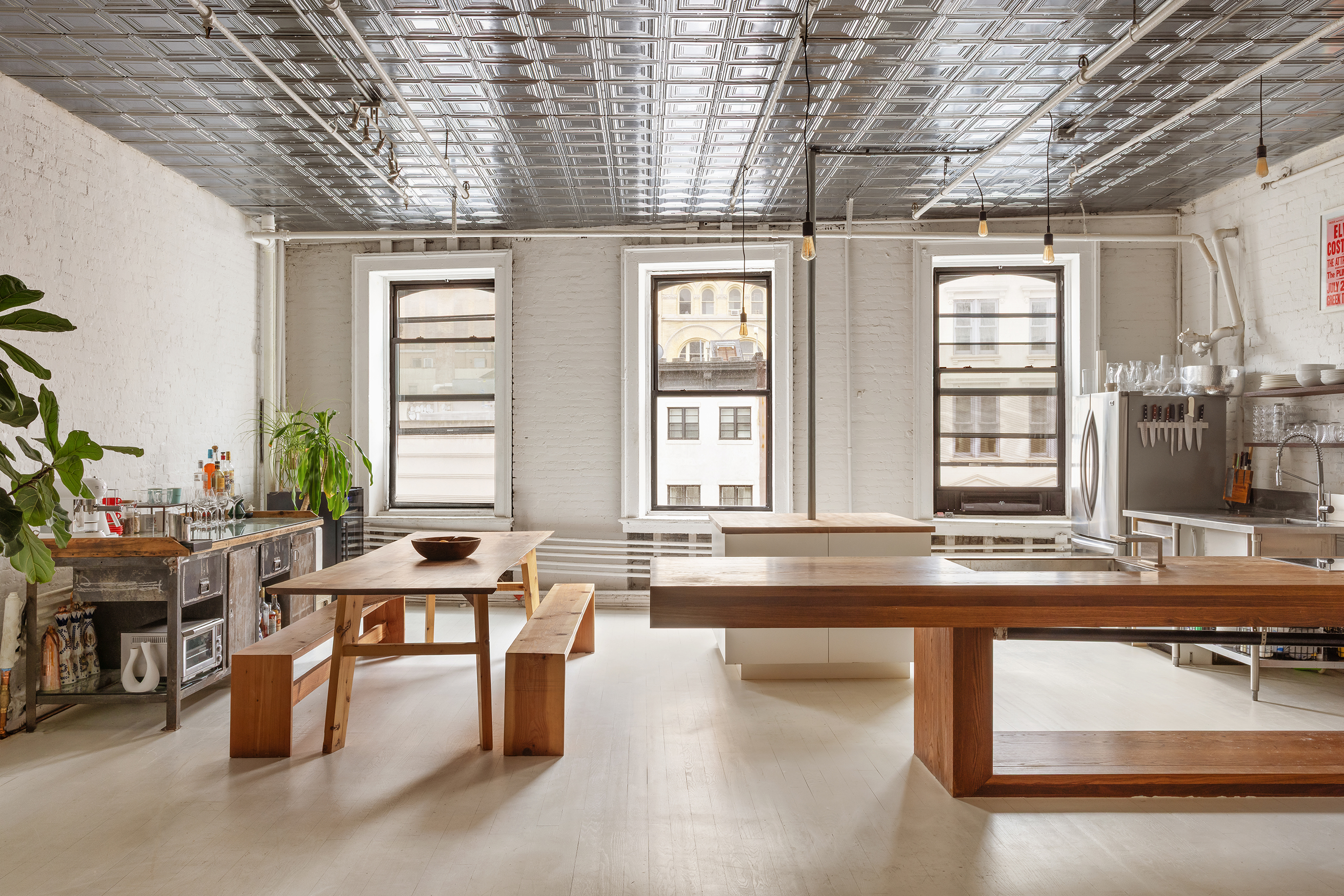 49 Howard Street, Unit 4S Manhattan, NY 10013 - Photo 5 of 12 a kitchen with stainless steel appliances granite countertop a sink and a counter space