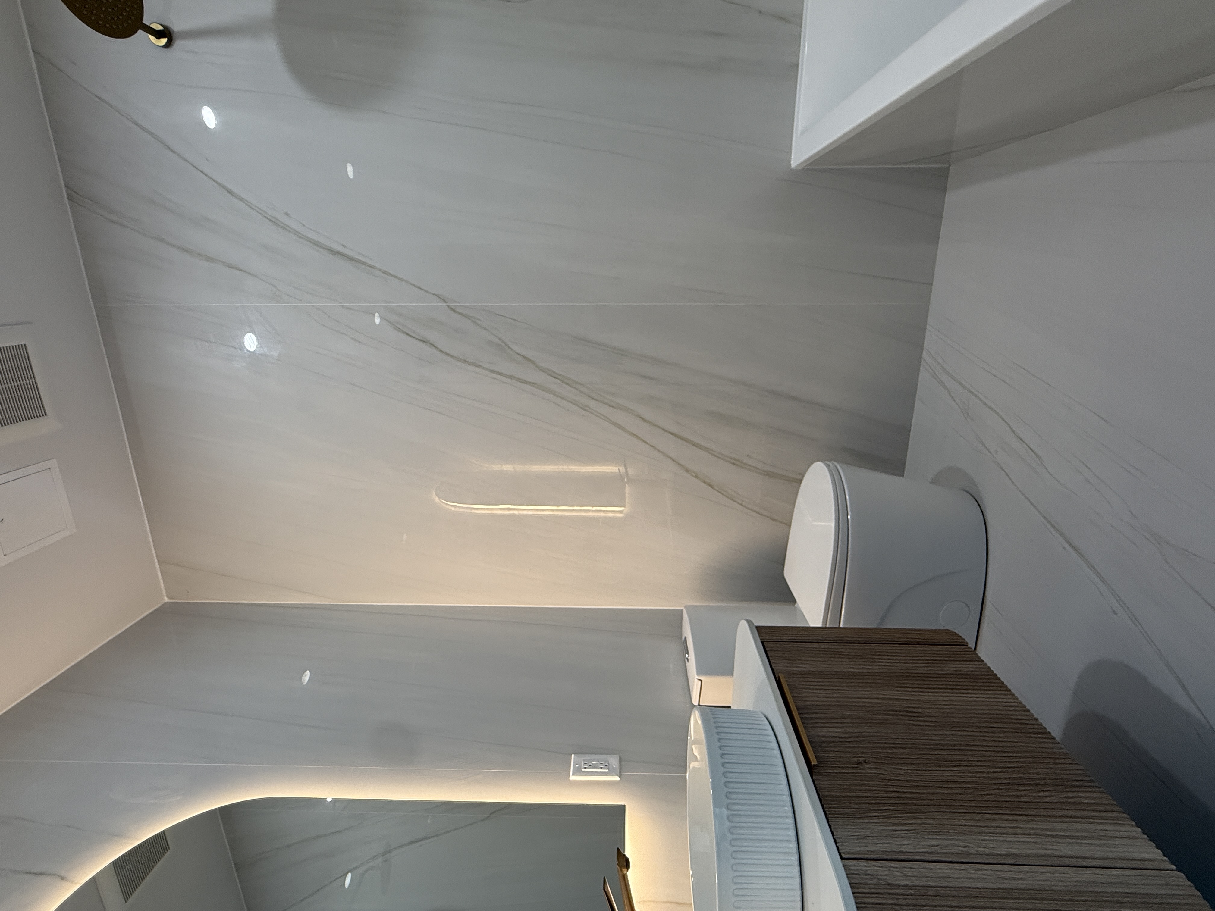 31-16 21st Street, Unit 3E Queens, NY 11106 - Photo 4 of 17 a bathroom with a toilet sink and mirror