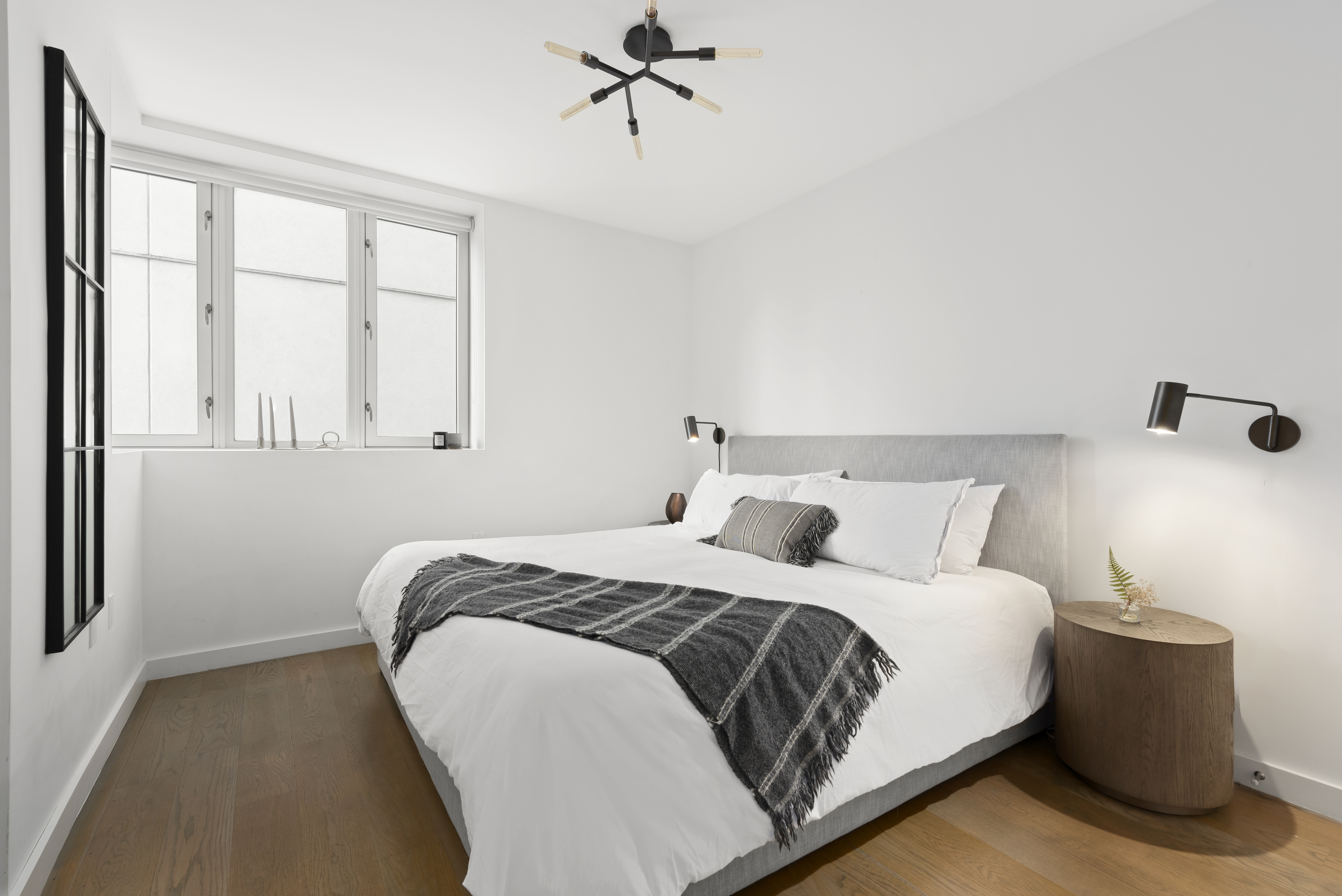 265 East Houston Street, Unit 4 Manhattan, NY 10002 - Photo 15 of 20 a bedroom with a bed and window