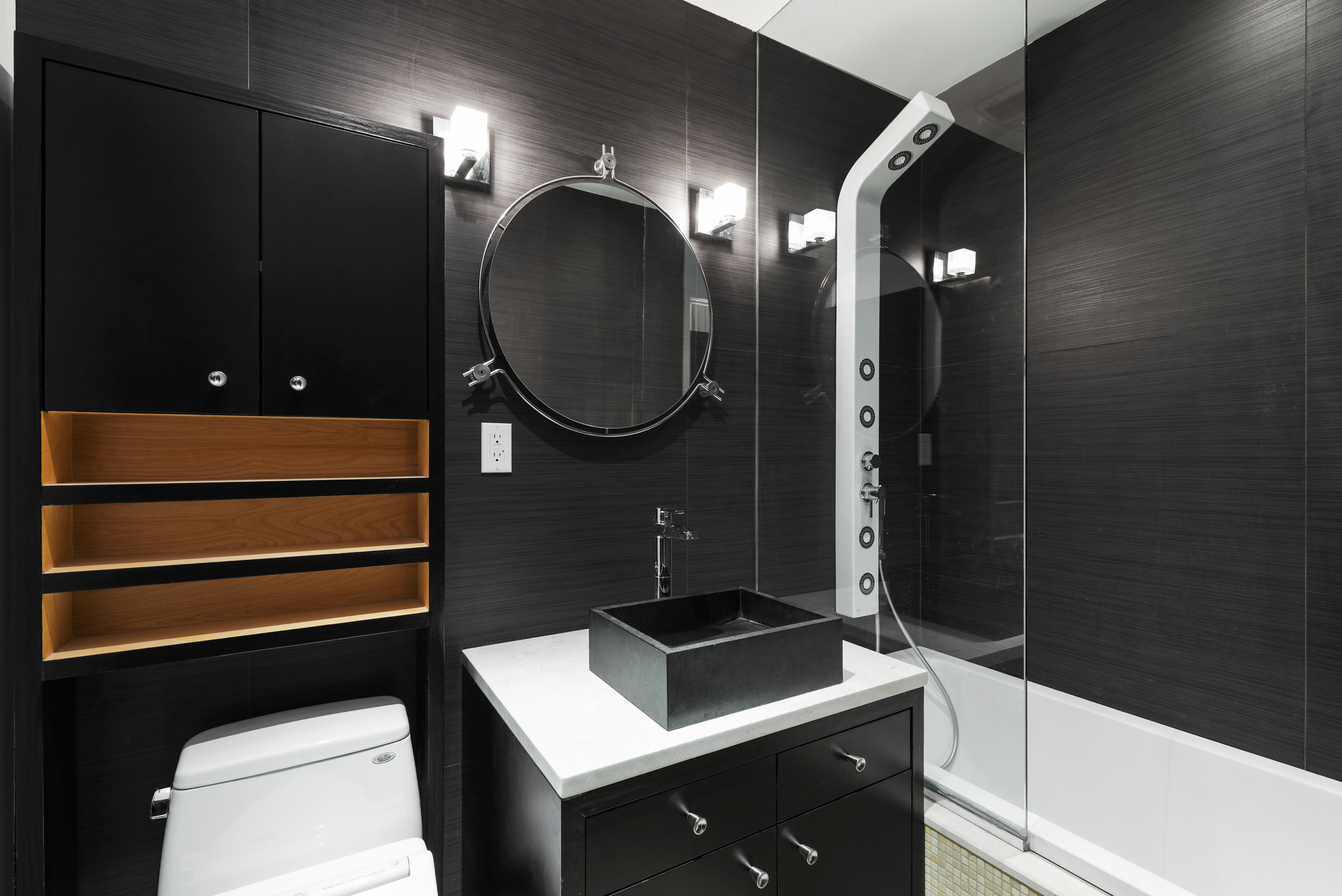 175 Franklin Street, Unit 4 Manhattan, NY 10013 - Photo 9 of 13 a bathroom with a toilet a sink and mirror