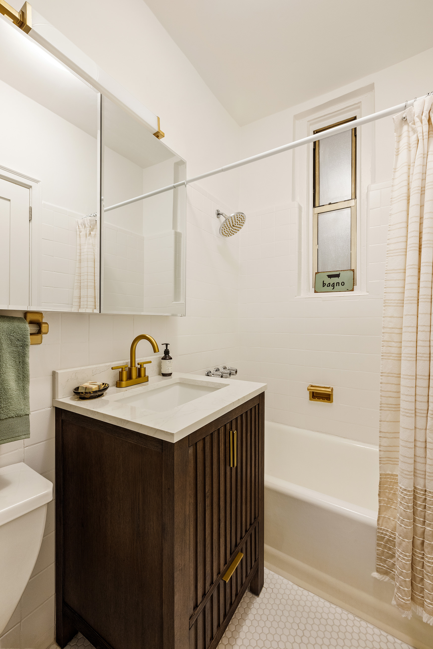 326 East 73rd Street, Unit 1A Manhattan, NY 10021 - Photo 4 of 6 a bathroom with a sink and a bathtub