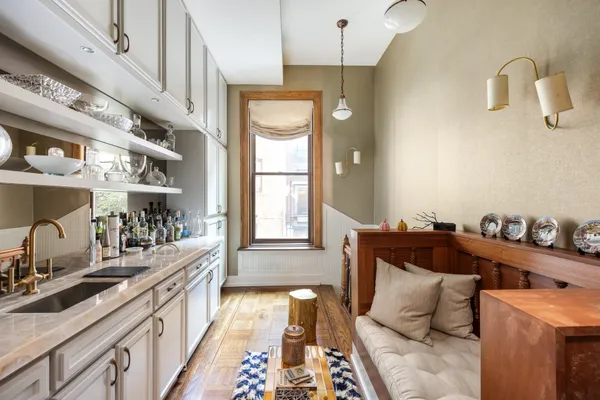 a bedroom with furniture and a window