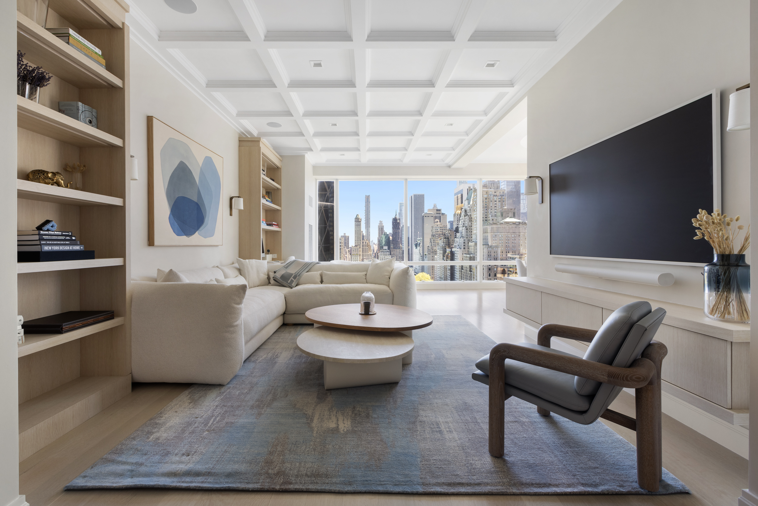 1 Central Park West, Unit 24D Manhattan, NY 10023 - Photo 3 of 19 a living room with couches and a flat screen tv