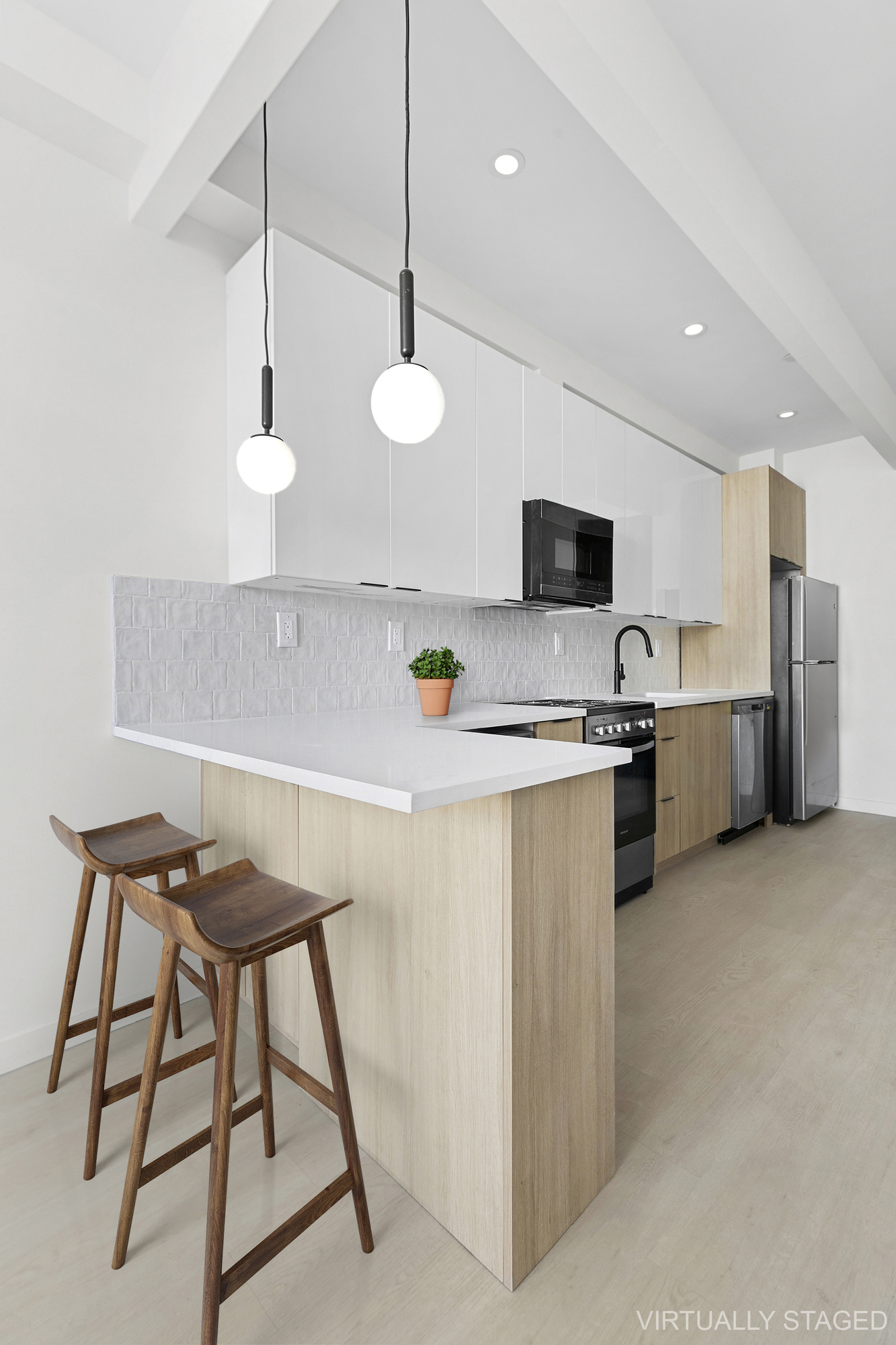 647 Dekalb Avenue, Unit 3B Brooklyn, NY 11216 - Photo 3 of 5 a kitchen with stainless steel appliances granite countertop a stove a sink and a refrigerator