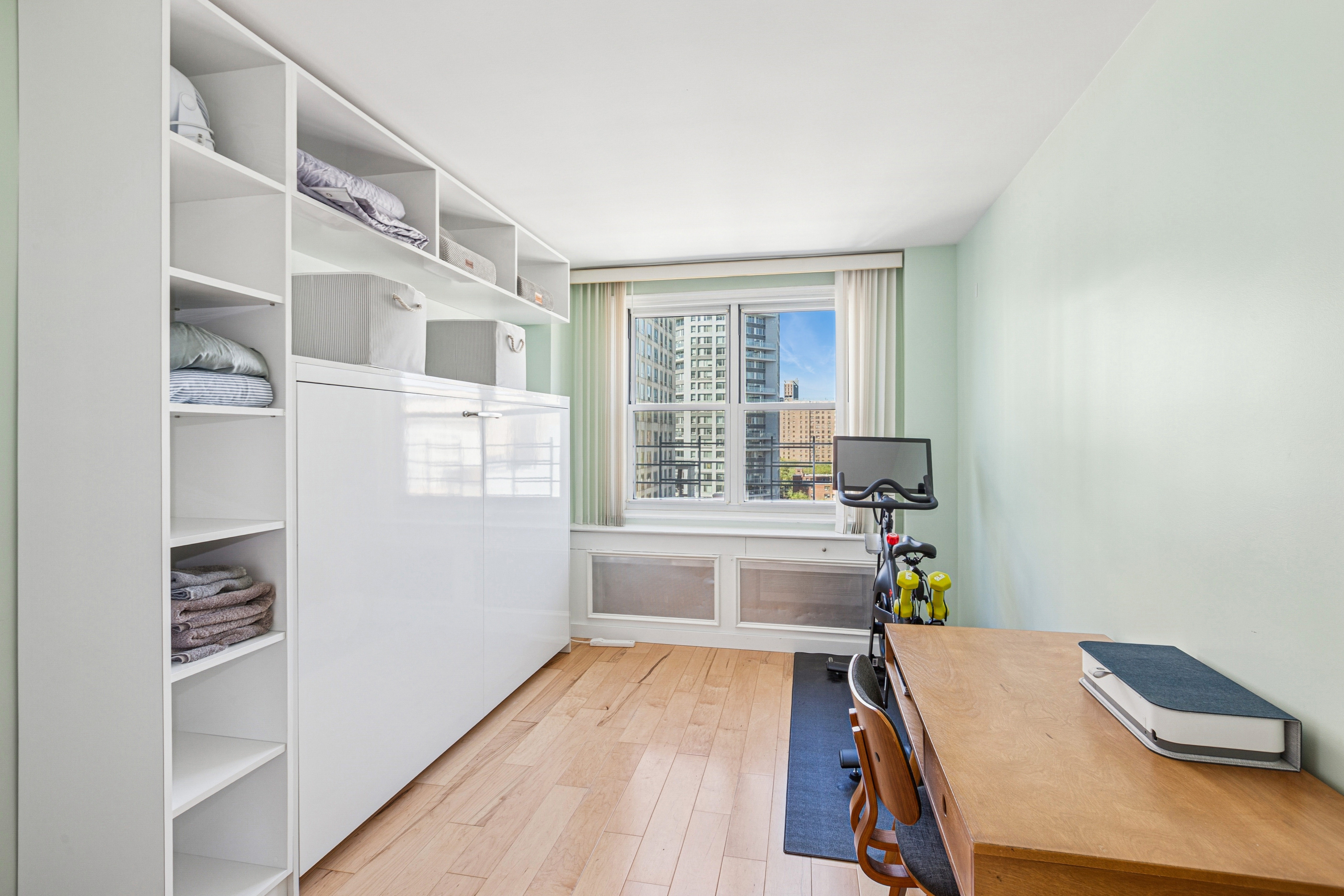 1270 5th Avenue, Unit 12C Manhattan, NY 10029 - Photo 9 of 18 a room with furniture and a window