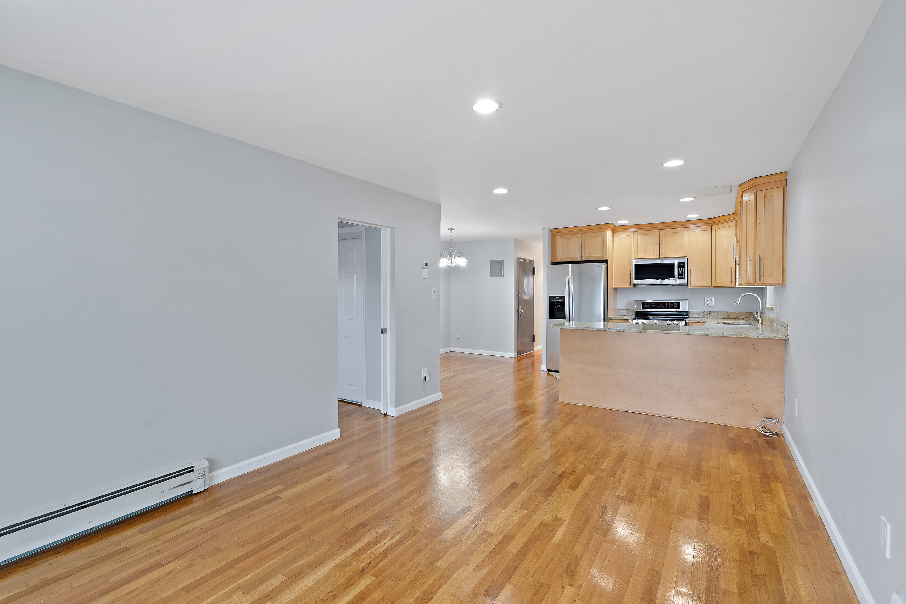 3230 Johnson Avenue, Unit 3 Bronx, NY 10463 - Photo 4 of 21 a view of kitchen with wooden floor