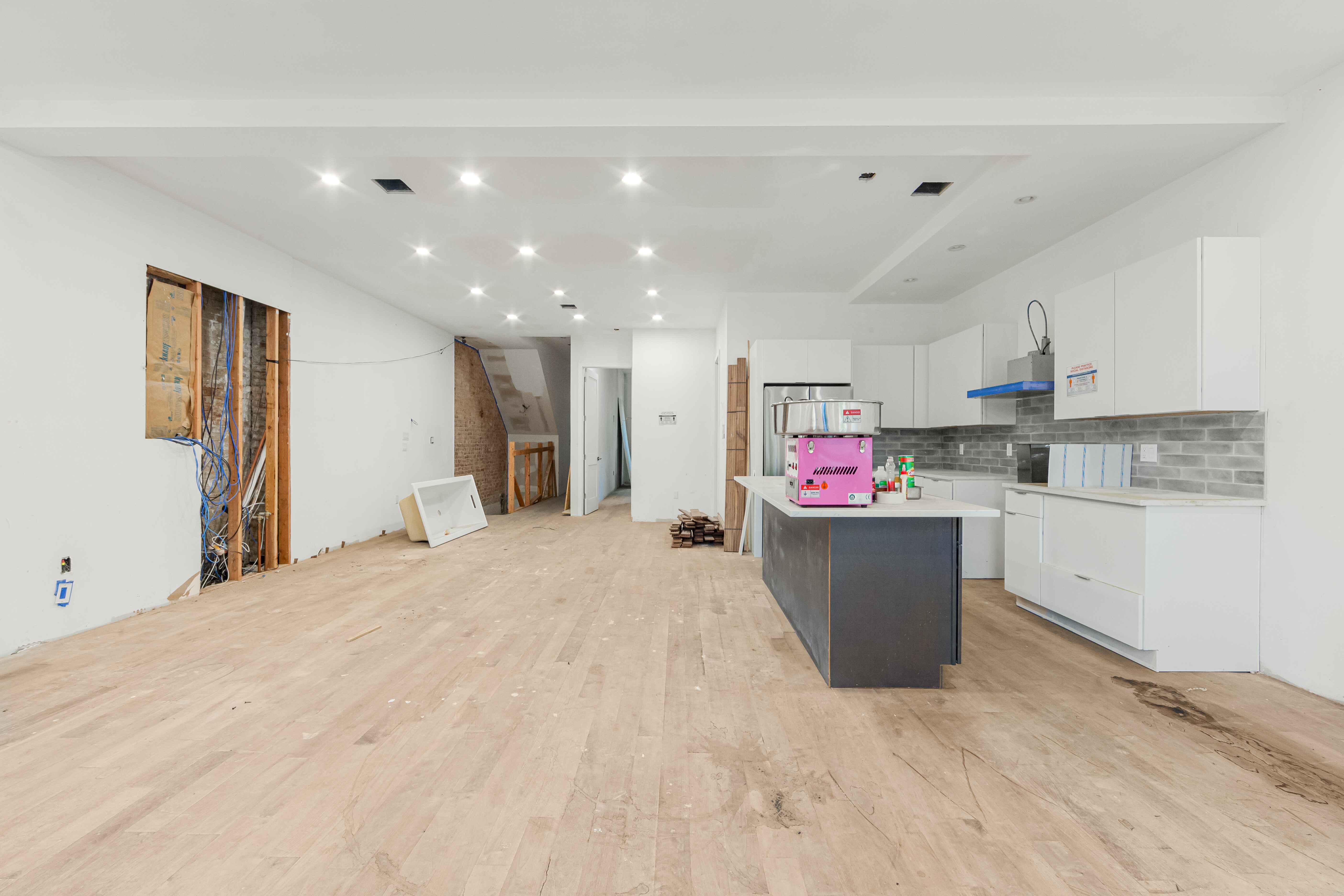 913 Lafayette Avenue Brooklyn, NY 11221 - Photo 4 of 19 a kitchen with a refrigerator and a more window