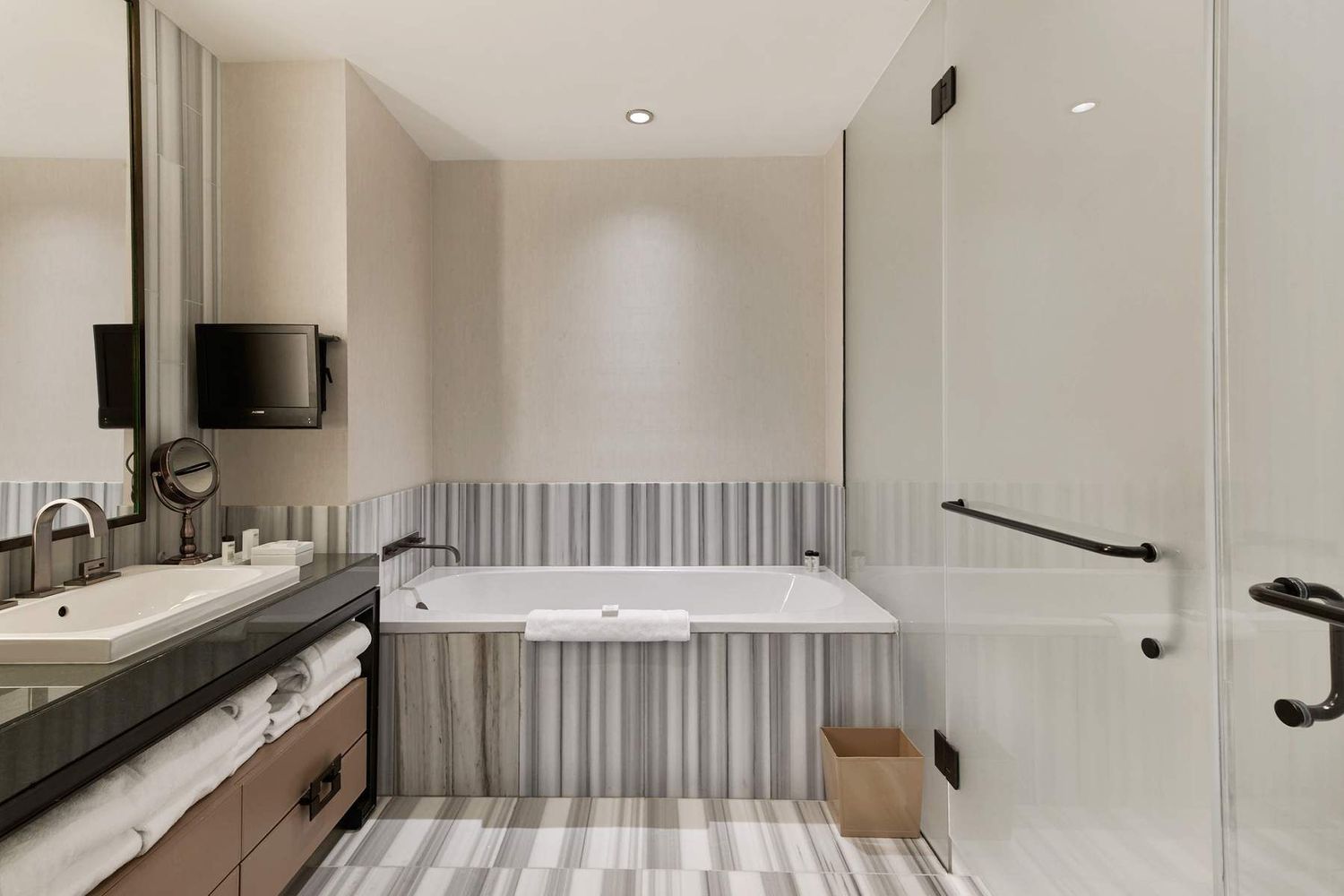 246 Spring Street, Unit 4111 Manhattan, NY 10013 - Photo 5 of 19 a bathroom with a sink and a mirror