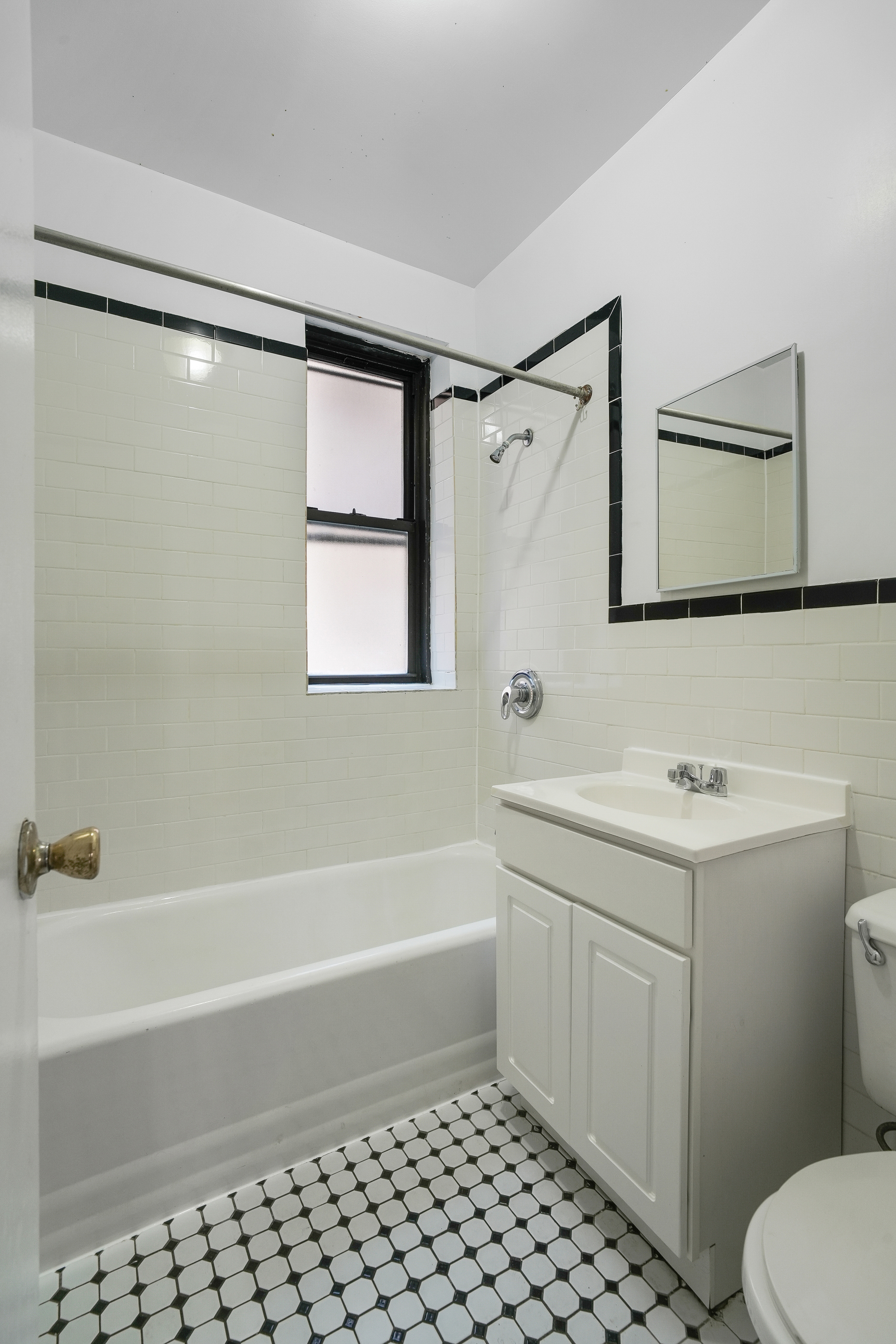 507 West 111th Street, Unit 3 Manhattan, NY 10025 - Photo 10 of 11 a bathroom with a sink a toilet and shower