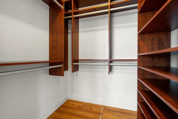 a view of a room with wooden floor