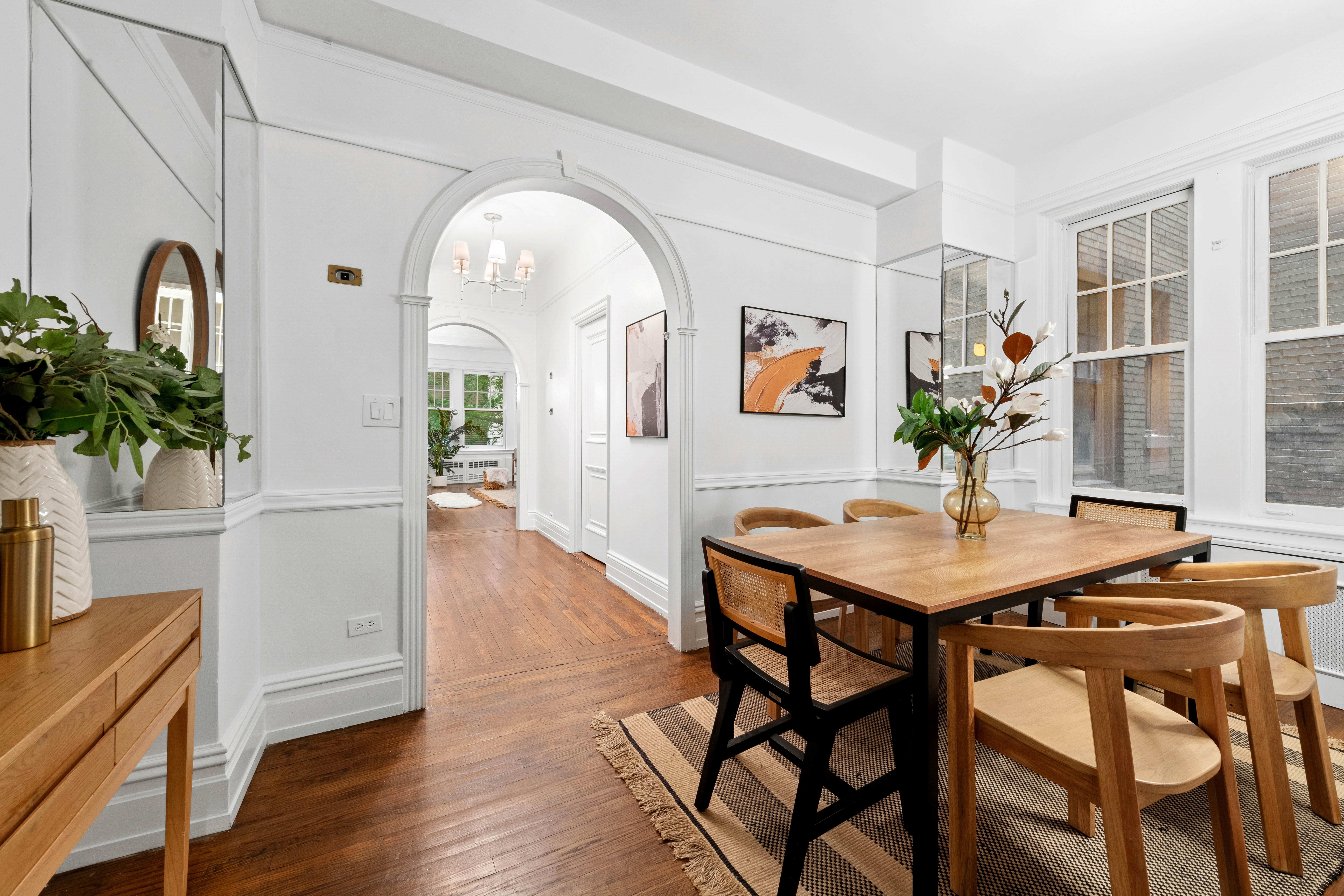 444 East 57th Street, Unit 5C Manhattan, NY 10022 - Photo 6 of 13 a view of a livingroom with furniture and a potted plant