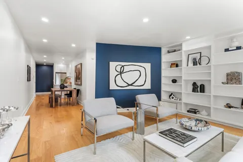 a living room with furniture and a table