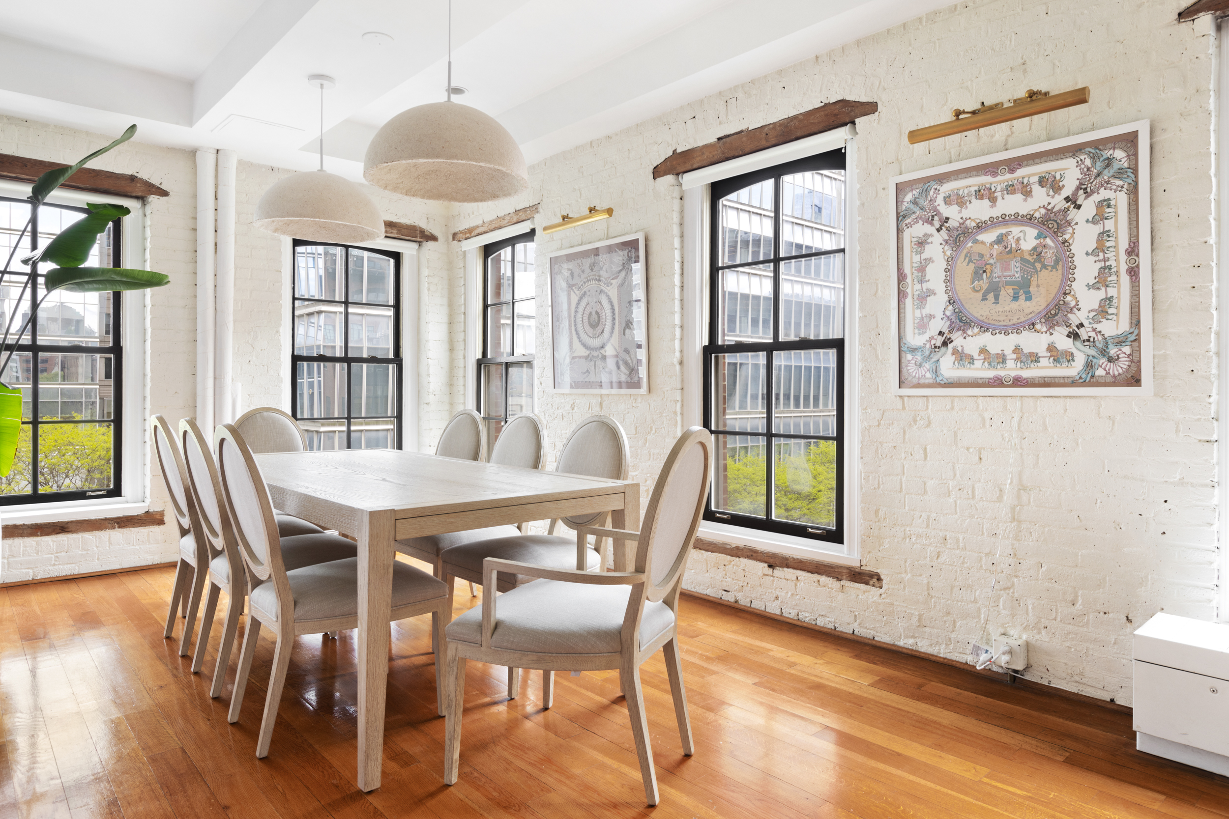 62 Beach Street, Unit 5E Manhattan, NY 10013 - Photo 6 of 15 a view of a dining room with furniture window and wooden floor