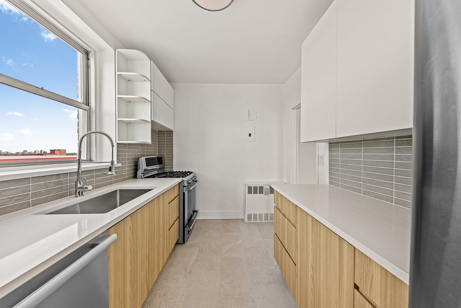 110-50 71st Road, Unit PHD Queens, NY 11375 - Photo 4 of 14 a kitchen with a sink and a refrigerator