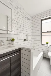 a bathroom with a sink a bathtub and a sink