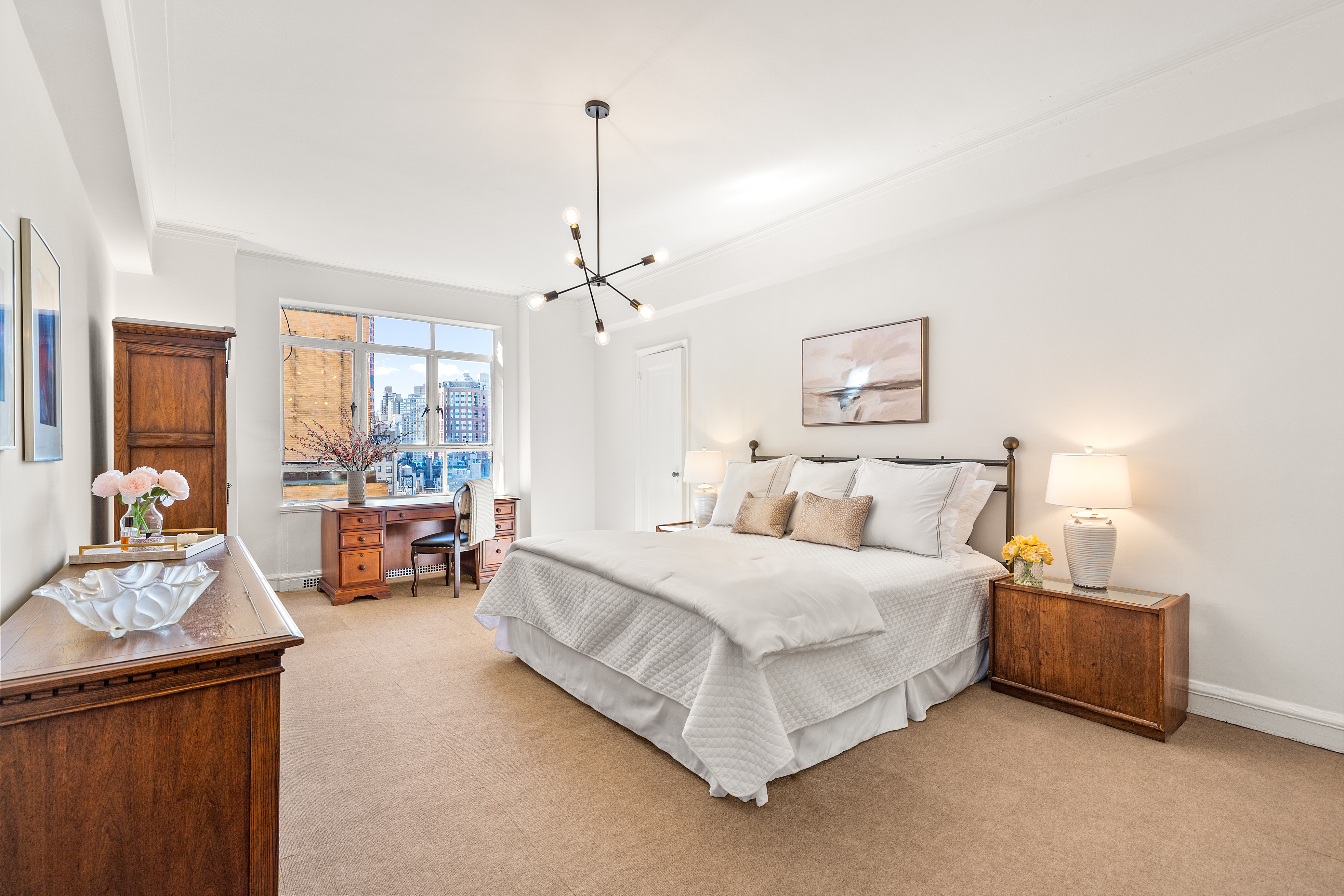 115 Central Park West, Unit 16H Manhattan, NY 10023 - Photo 14 of 30 a spacious bedroom with a bed and furniture