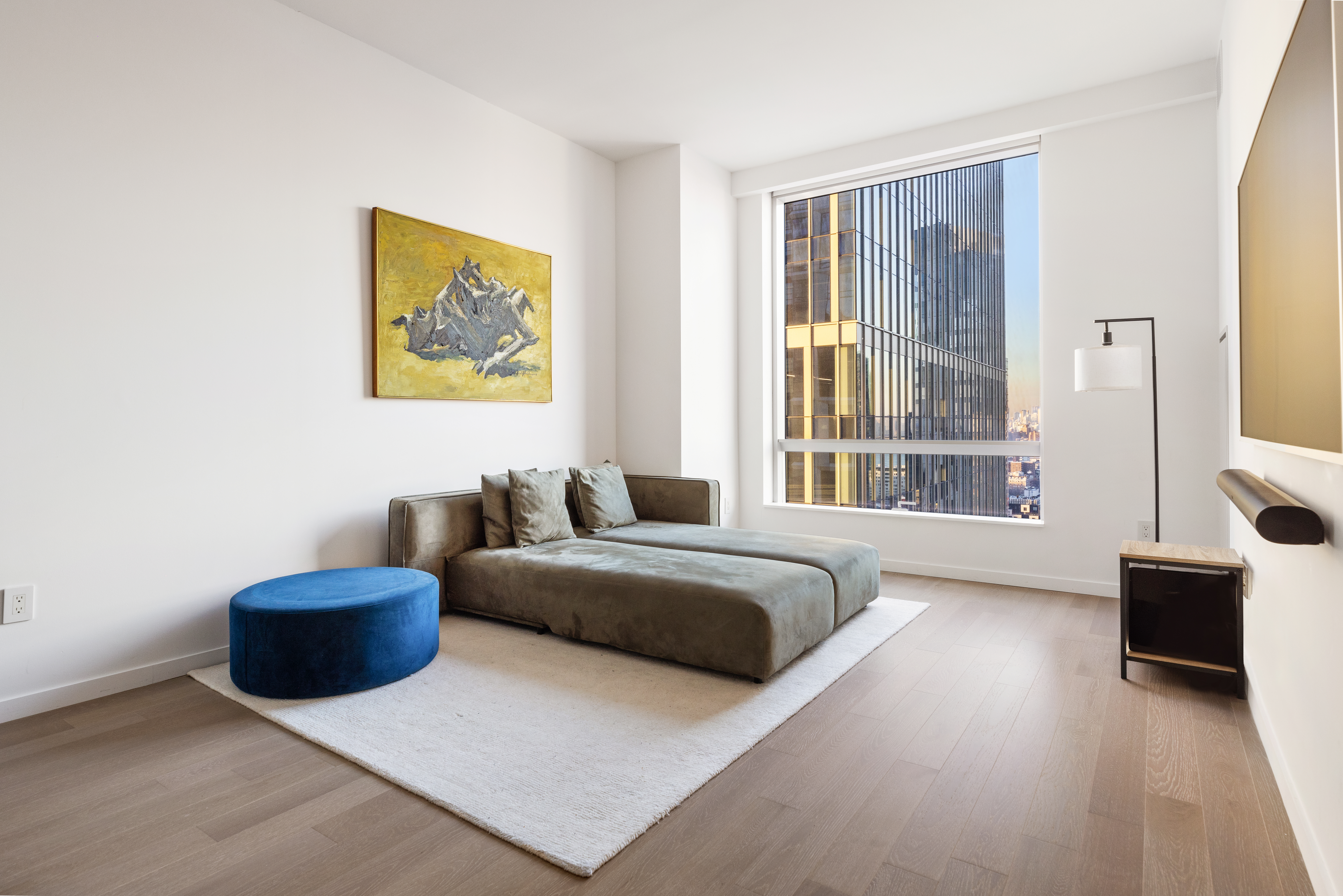 a bedroom with a bed and a couch