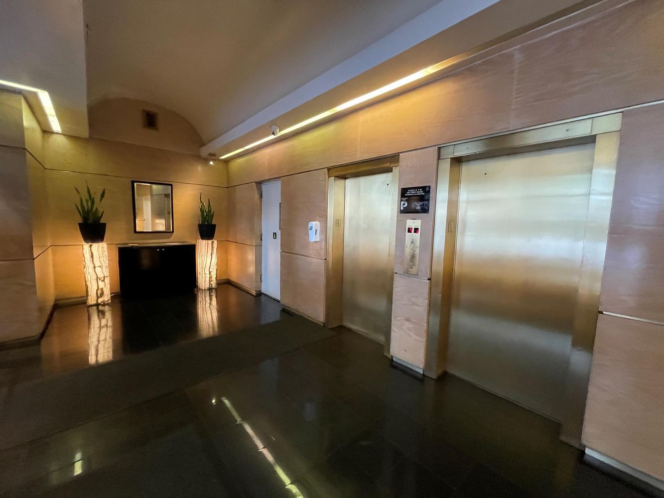 40 Sutton Place, Unit 8D Manhattan, NY 10022 - Photo 9 of 12 a kitchen with a refrigerator and a sink