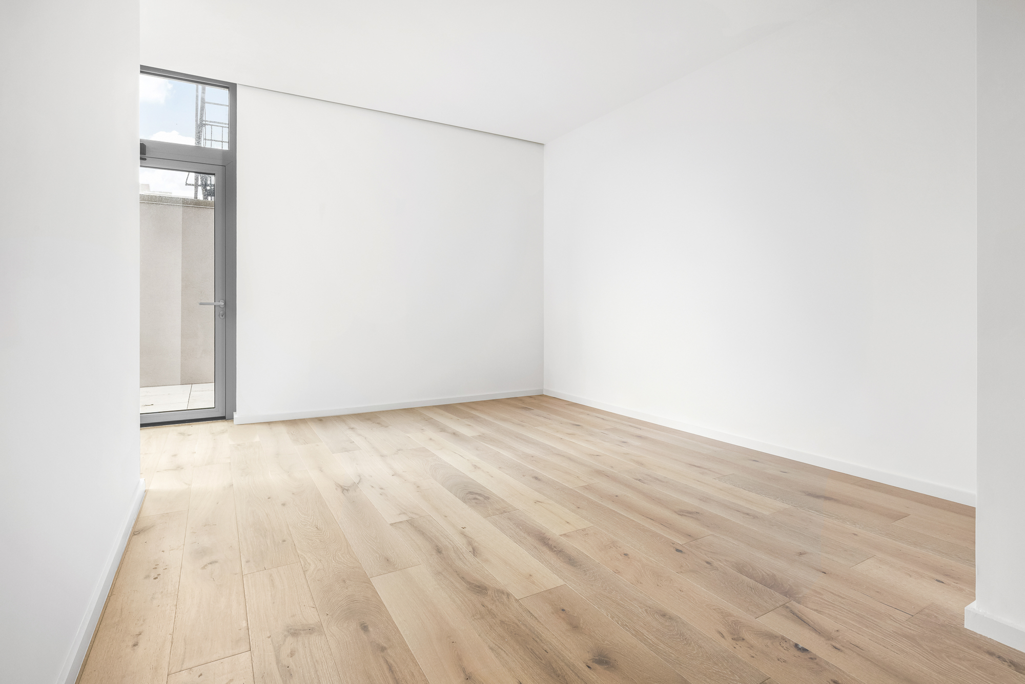 66 Clinton Street, Unit 1A Manhattan, NY 10002 - Photo 5 of 20 a view of empty room with wooden floor