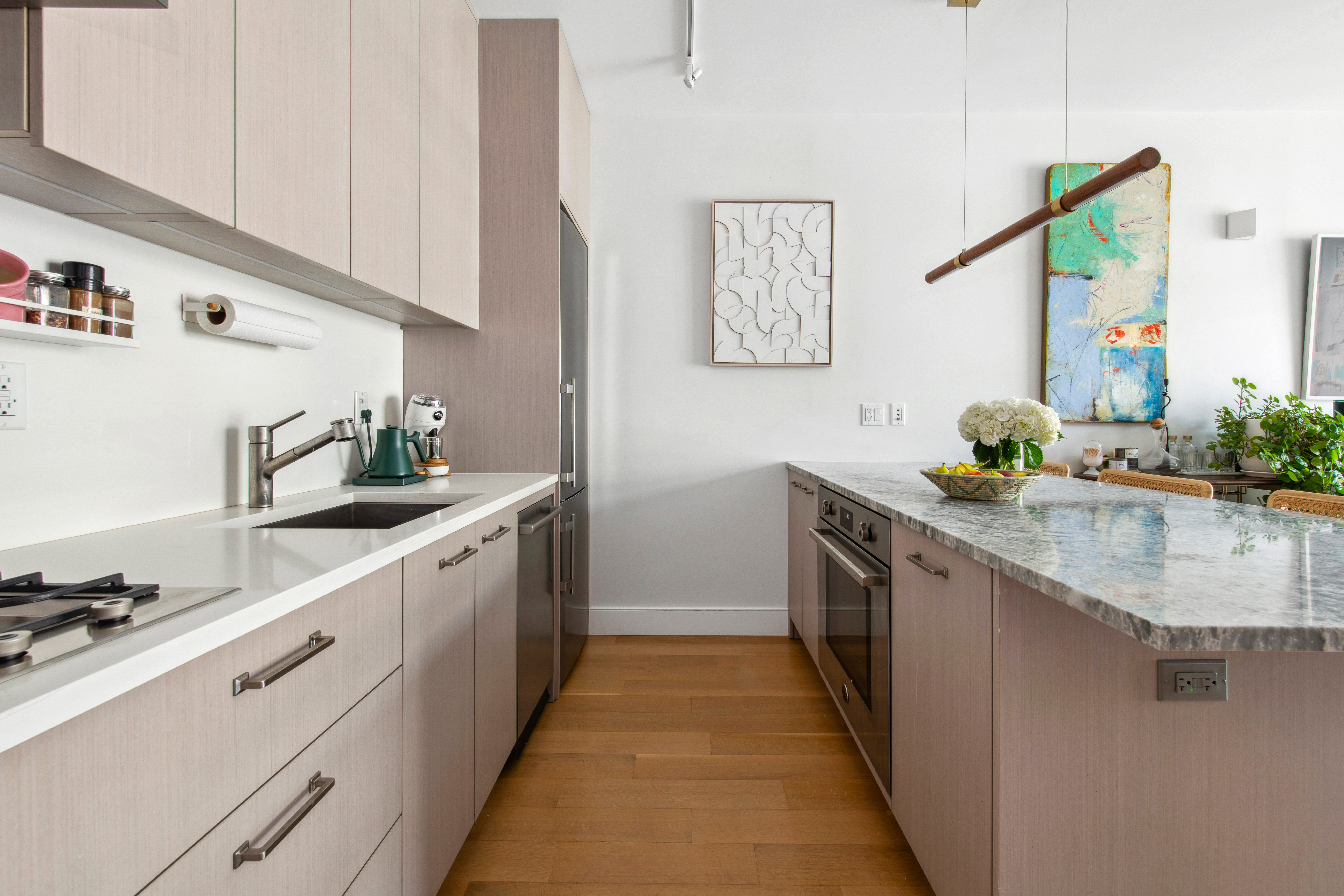 536 East 13th Street, Unit 5F Manhattan, NY 10009 - Photo 7 of 16 a large kitchen with stainless steel appliances granite countertop a sink stove and cabinets