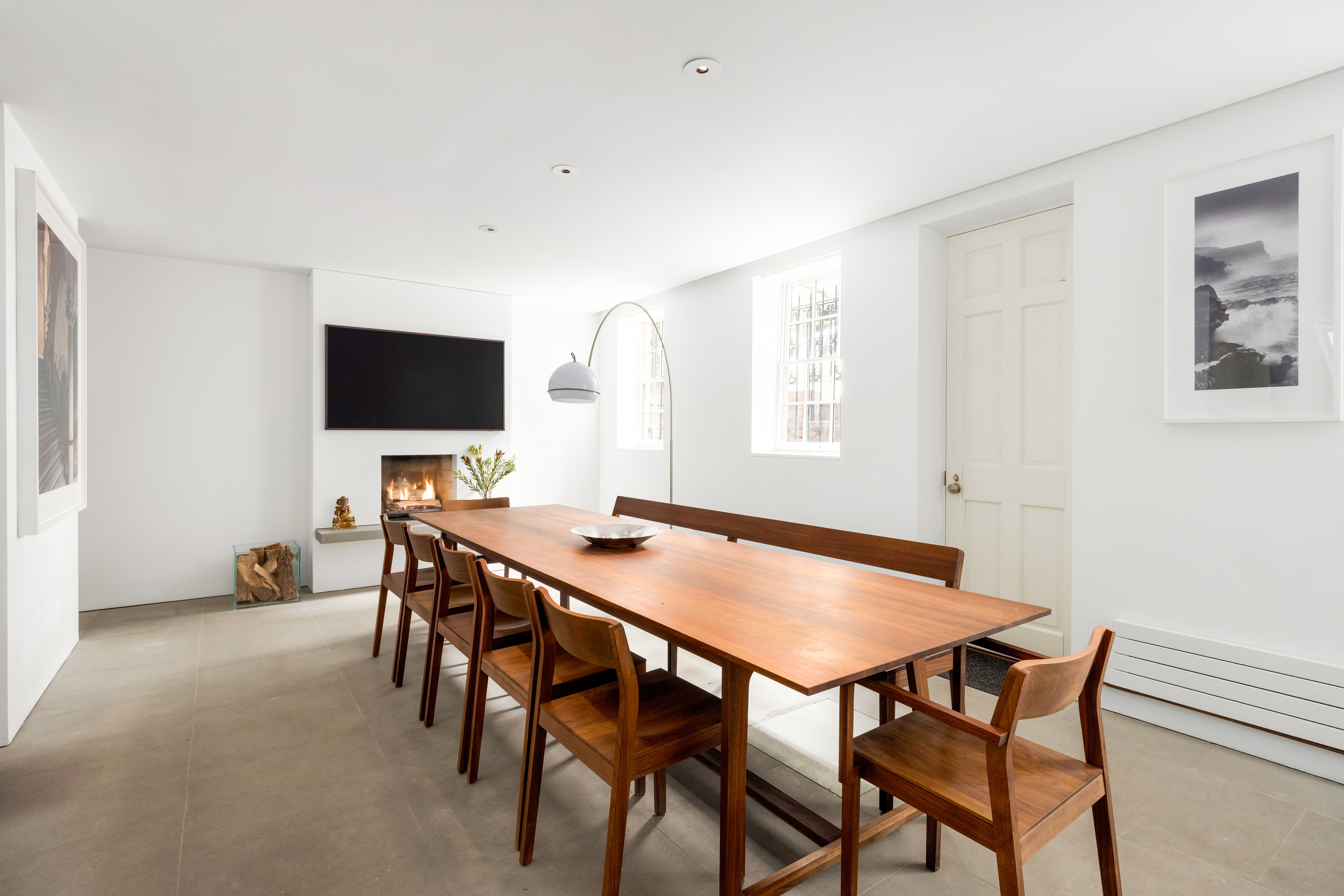 130 Charles Street Manhattan, NY 10014 - Photo 7 of 15 a view of a dining room with furniture and a flat screen tv