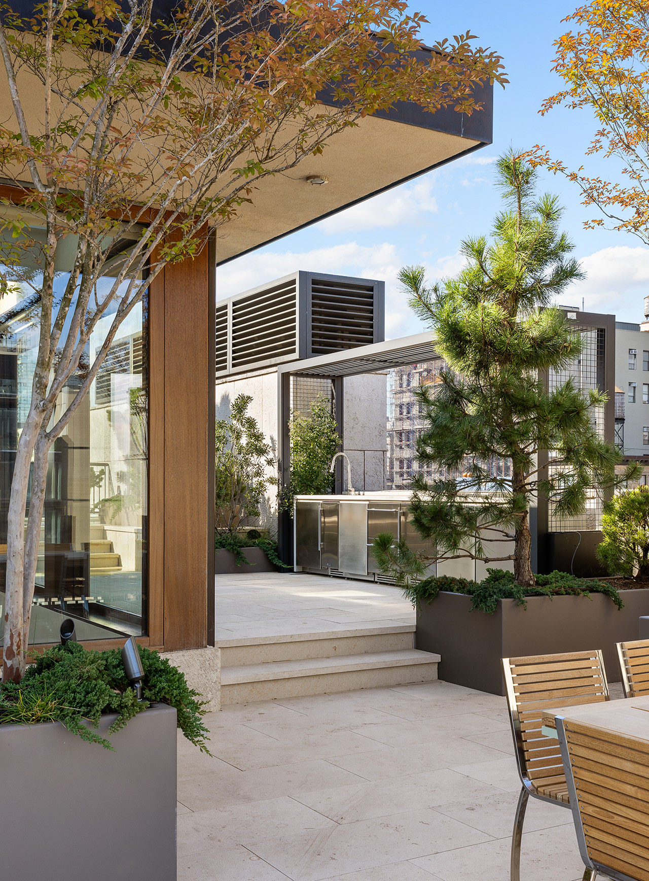 25 Bond Street, Unit PHW Manhattan, NY 10012 - Photo 26 of 34 a view of a patio with couches table and chairs and potted plants