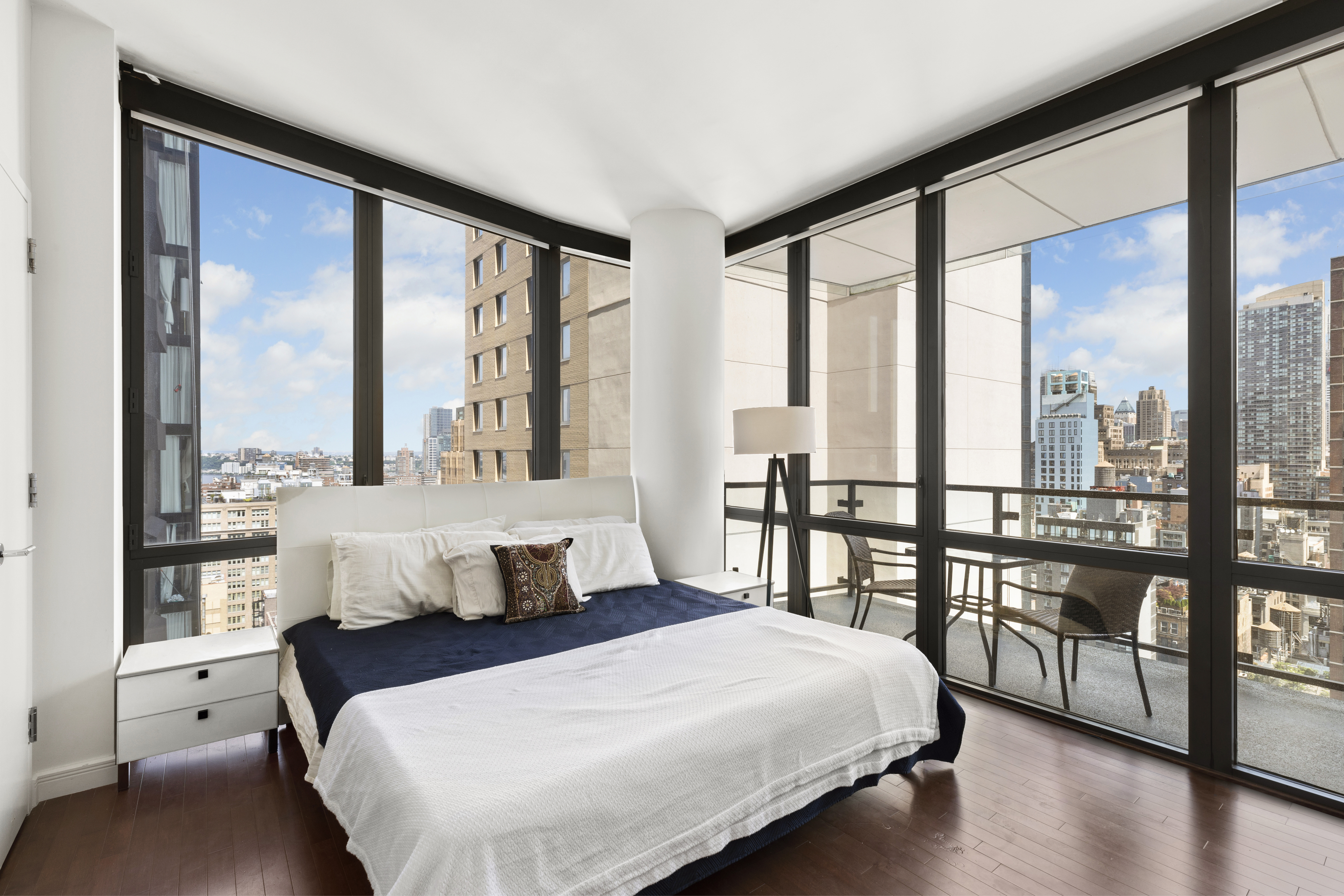 101 West 24th Street, Unit 26A Manhattan, NY 10011 - Photo 6 of 21 a bedroom with a large bed and a large window