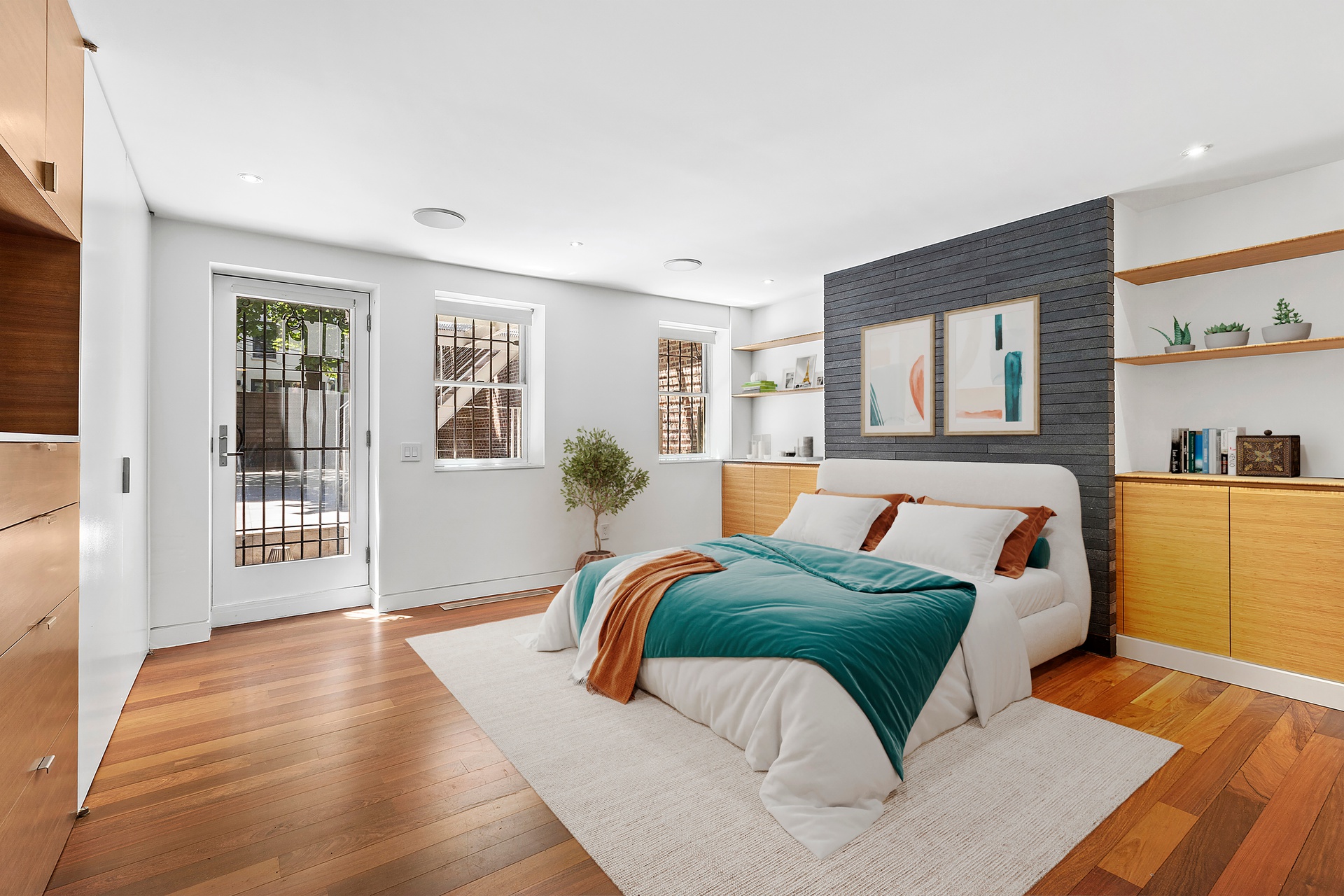 64 Clifton Place Brooklyn, NY 11238 - Photo 8 of 22 a bedroom with a large bed and a couch