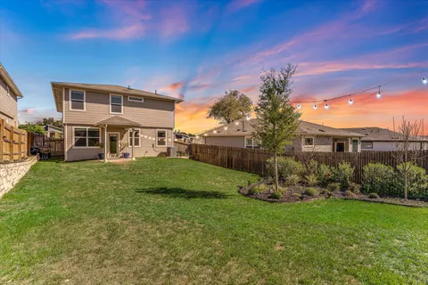 a view of a house with a yard porch and sitting area