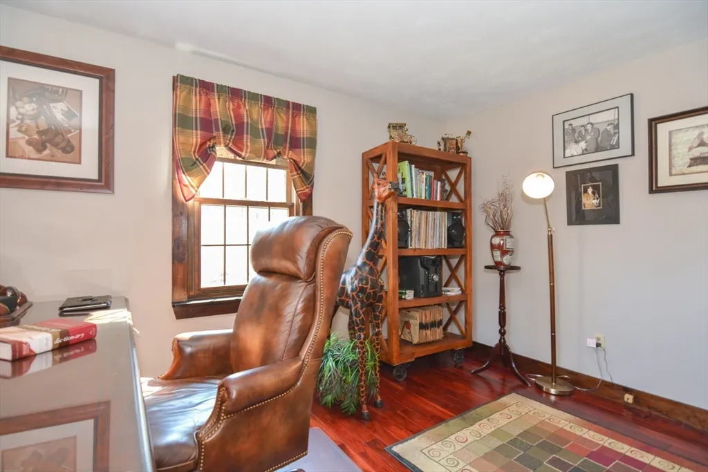 a view of a livingroom with furniture and a workspace