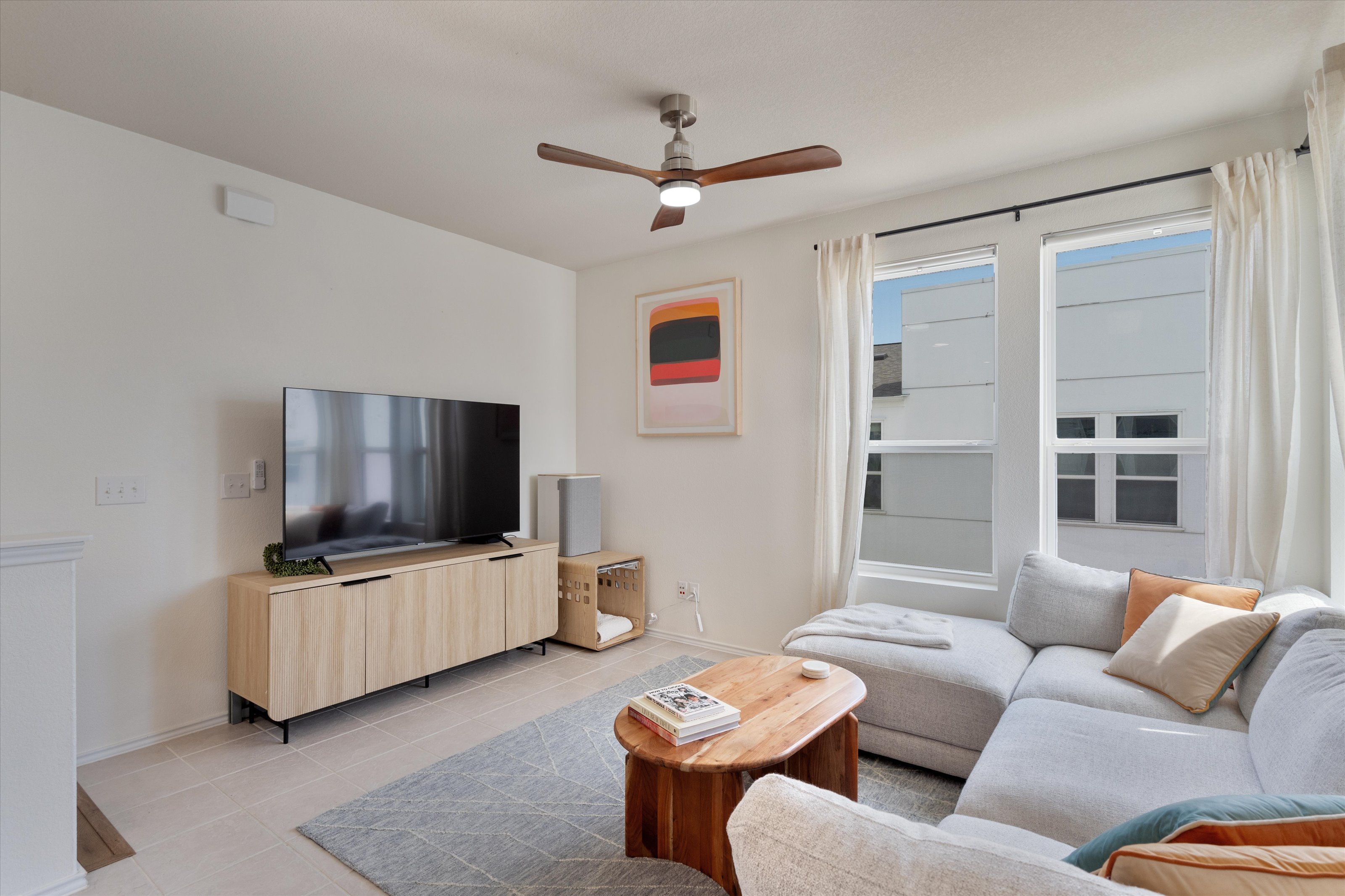 4330 Olenick Street Austin, TX 78723 - Photo 19 of 29 a living room with furniture and a flat screen tv
