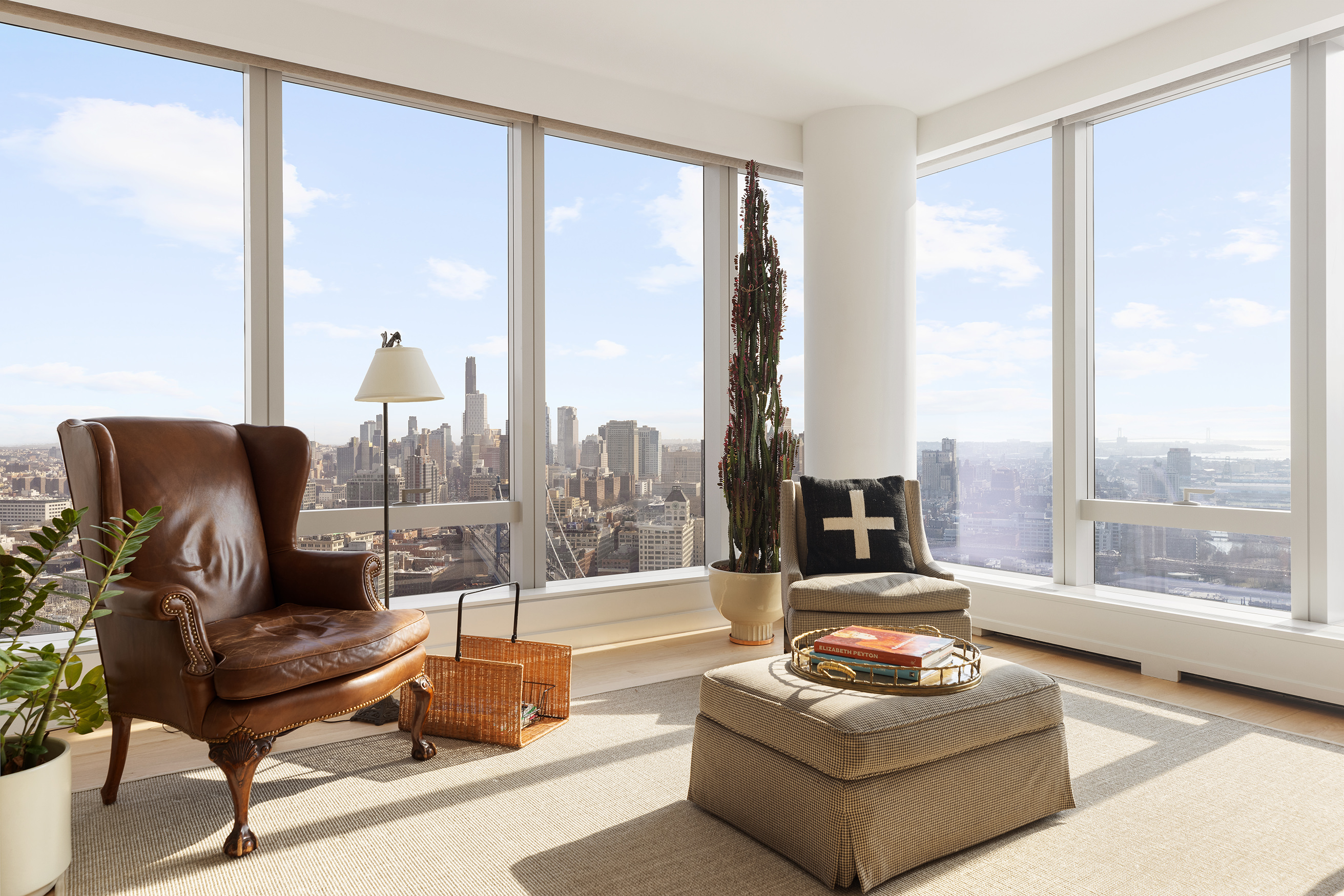 252 South Street, Unit 43C Manhattan, NY 10002 - Photo 2 of 10 a living room with furniture and a large window