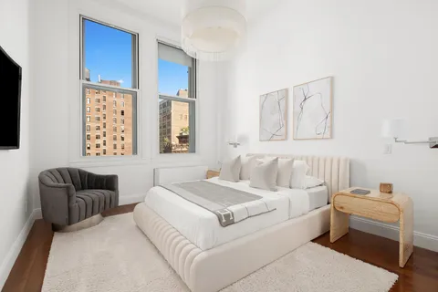 a bed room with a bed and a couch
