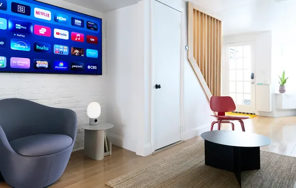 a living room with furniture and a chair