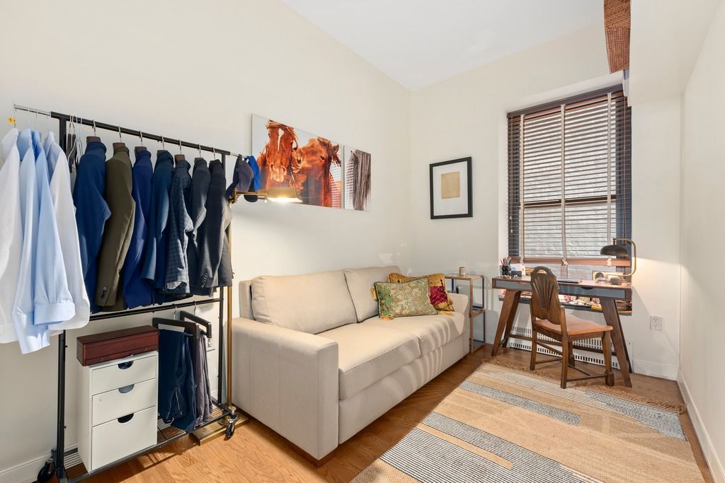 a living room with furniture and a rug