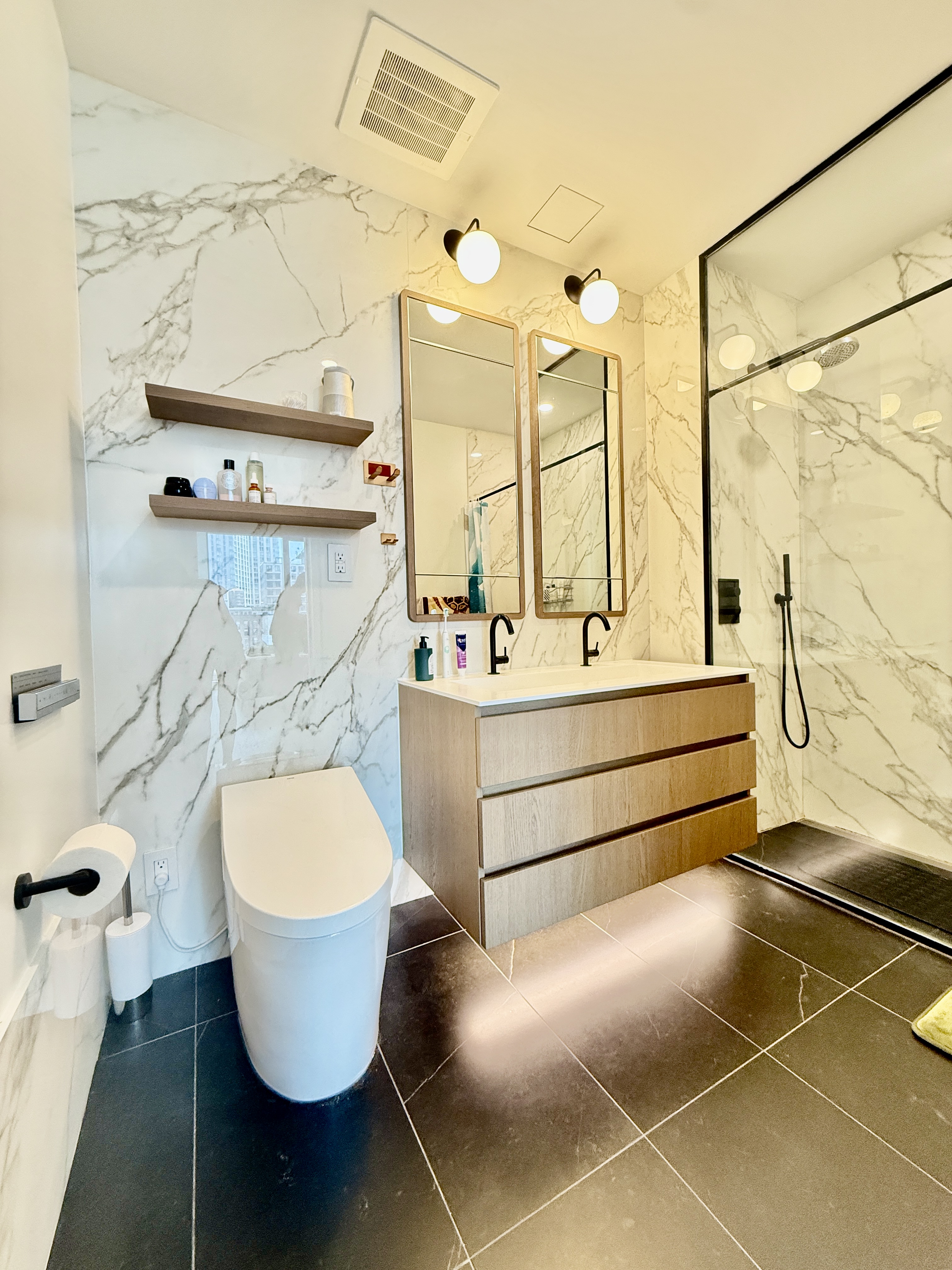 4507 Court Square, Unit 8D Queens, NY 11101 - Photo 9 of 28 a bathroom with a sink mirror and a bathtub