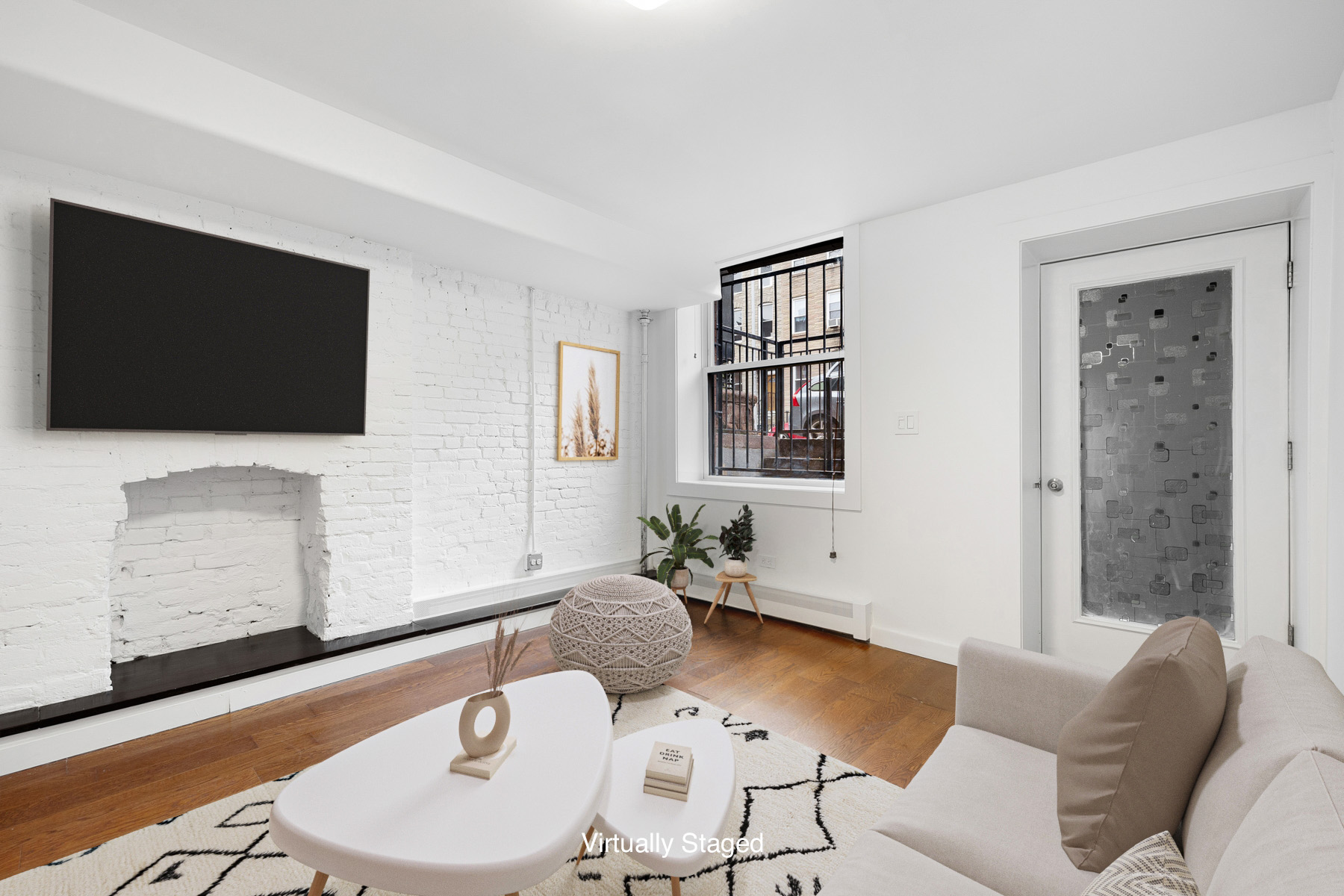 63 Putnam Avenue Brooklyn, NY 11238 - Photo 3 of 11 a living room with furniture and a flat screen tv