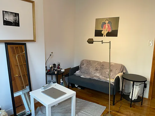 314 East 11th Street, Unit 3A Manhattan, NY 10003 - Photo 5 of 6 a living room with furniture and a wooden floor