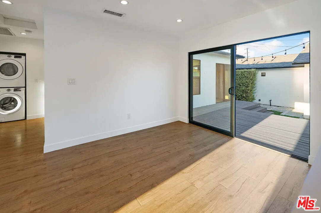 a view of a hallway with washer and dryer