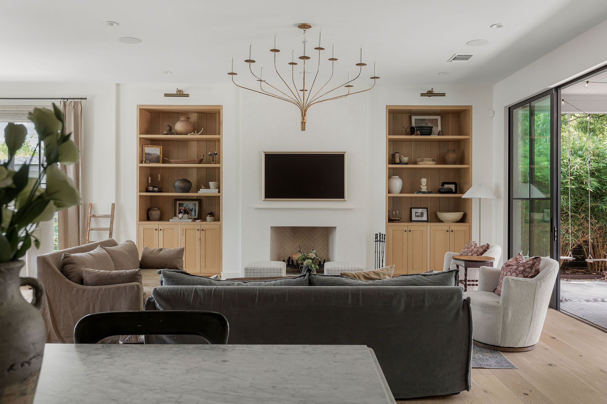 4700 Clawson Road Austin, TX 78745 - Photo 11 of 26 a living room with furniture a flat screen tv and a large window