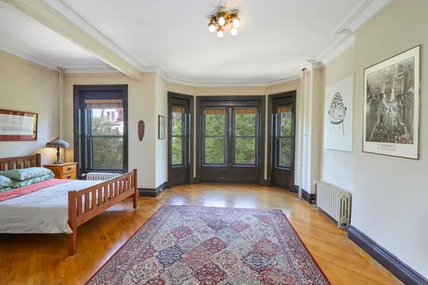 a bedroom with furniture and a window