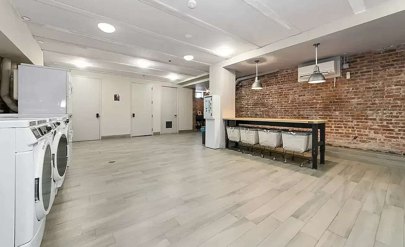 180 Bainbridge Street, Unit 211 Brooklyn, NY 11233 - Photo 14 of 21 a view of livingroom with furniture and a fireplace